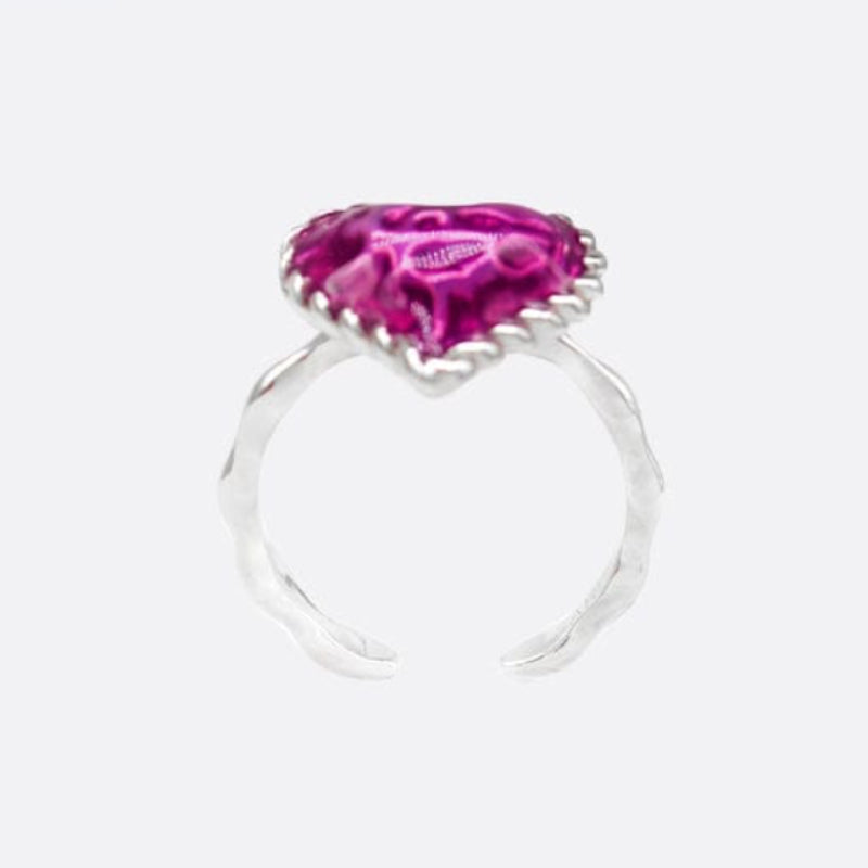 Silver ring with a pink gemstone on a white background, branded 'SAHI LONDON'.