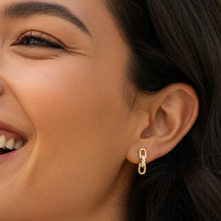 Woman with a bright smile outdoors with greenery in the background