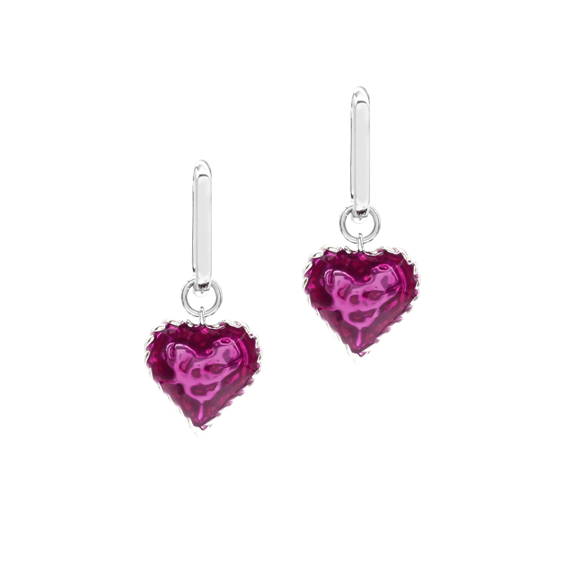 Heart-shaped earrings with pink gemstones on a clear background